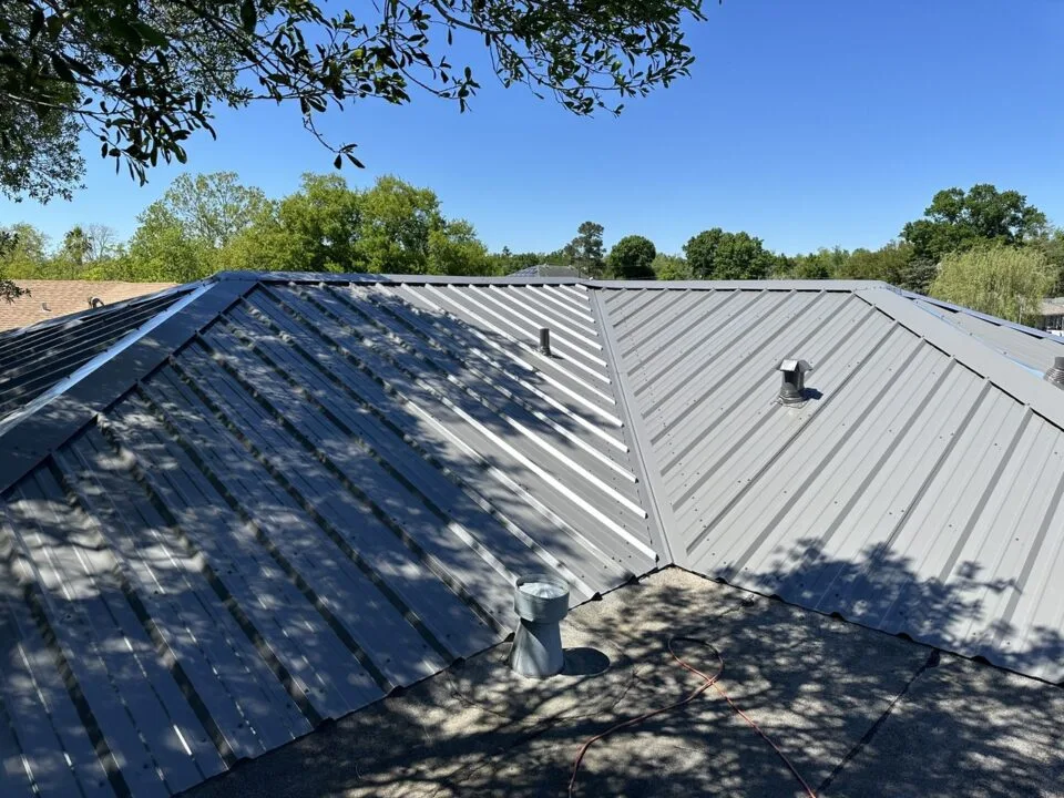 R-Panel metal roof installation